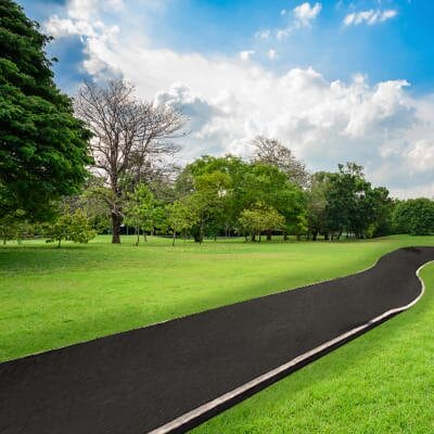 Bitumen emulsion applied on a rural pathway creating a smooth, eco-friendly asphalt surface