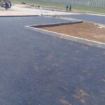Finished car park with defined edge paving, ready for final markings and landscaping at a commercial site
